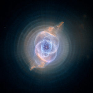 In this detailed view from the NASA/ESA Hubble Space Telescope, the so-called Cat's Eye Nebula looks like the penetrating eye of the disembodied sorcerer Sauron from the film adaptation of "Lord of the Rings." The nebula, formally catalogued NGC 6543, is every bit as inscrutable as the J.R.R. Tolkien phantom character. Although the Cat's Eye Nebula was among the first planetary nebula ever to be discovered, it is one of the most complex planetary nebulae ever seen in space. A planetary nebula forms when Sun-like stars gently eject their outer gaseous layers to form bright nebulae with amazing twisted shapes.
